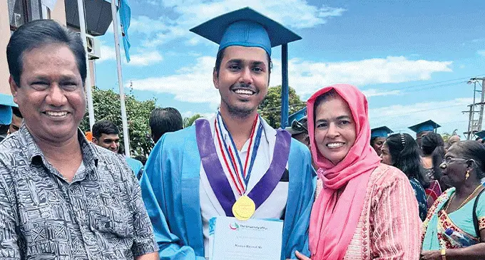 University of Fiji graduate Razeen Ali, with parents Shaukat and Shofia Ali after the graduation ceremony.