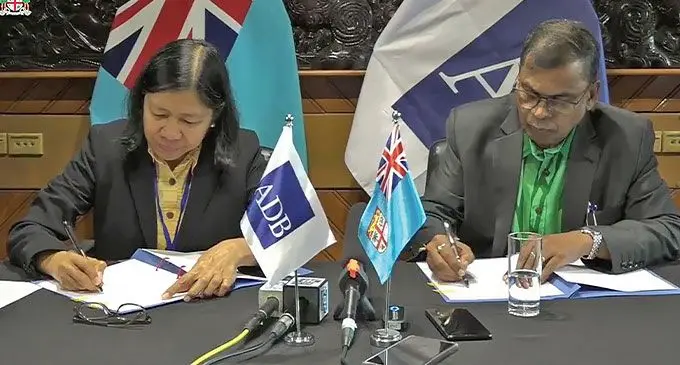 Asian Development Bank (ADB) director-general for the Pacific Leah Gutierrez with Minister for Finance Biman Prasad during the signing on August 1, 2024.