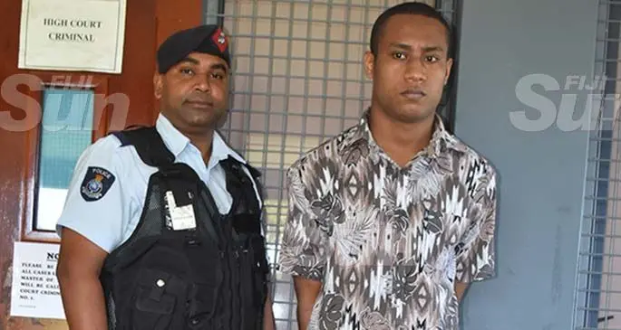 Police Constable Sumit Chand with murderer and rapist Mosese Cama outside of the High Court in Labasa. Photo: Laisa Lui