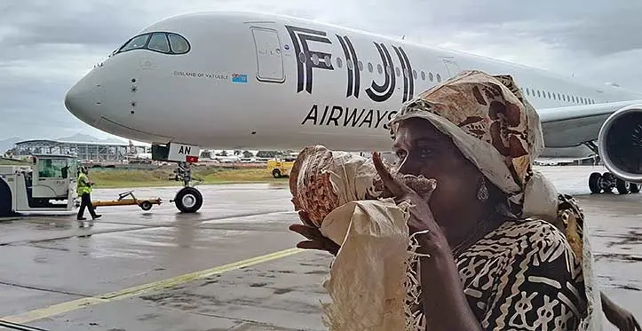 Sera Musunamasi blows the davui welcoming the new Fiji Airways Airbus A350-900 XWB aircraft. Photo: Waisea Nasokia