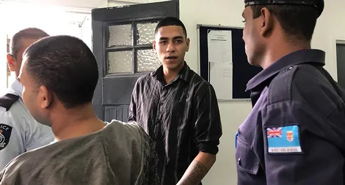 Accused Saula Temo (looking at camera), outside the High Court in Suva on  November 18, 2019. Photo: Ashna Kumar