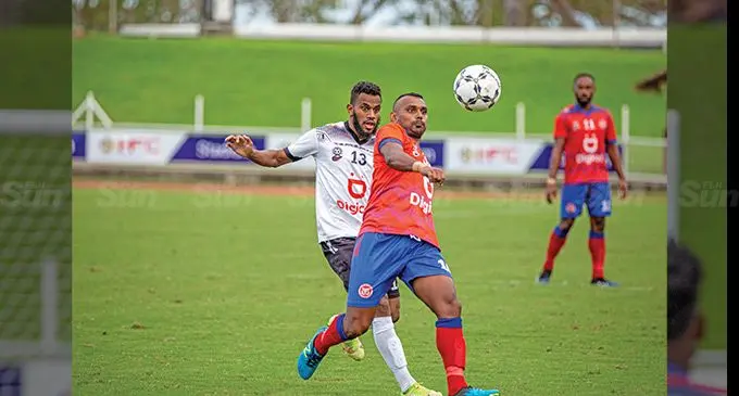 Navua’s Vineet Chand clears the ball againsts Suva’s Azairah Soromon during their Digicel Premier League match at the HFC Bank Stadium on August 14, 2022. Photo: Leon Lord