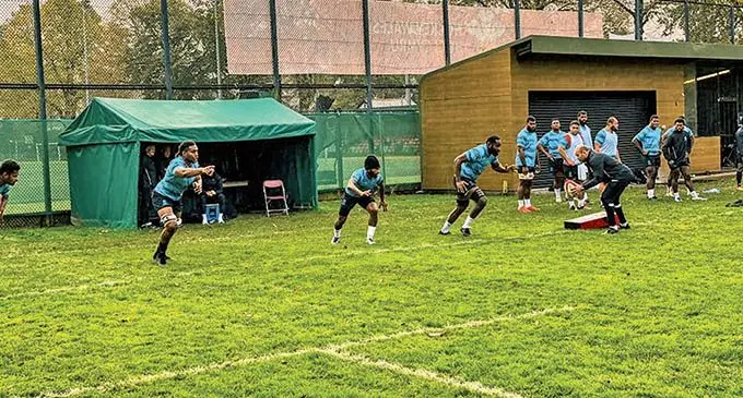 From left: Viliame Mata, Frank Lomani  (centre) trains with  Vodafone Flying Fijians  teammates in Cardiff, Wales on November 10, 2021. Photo: FRU Media