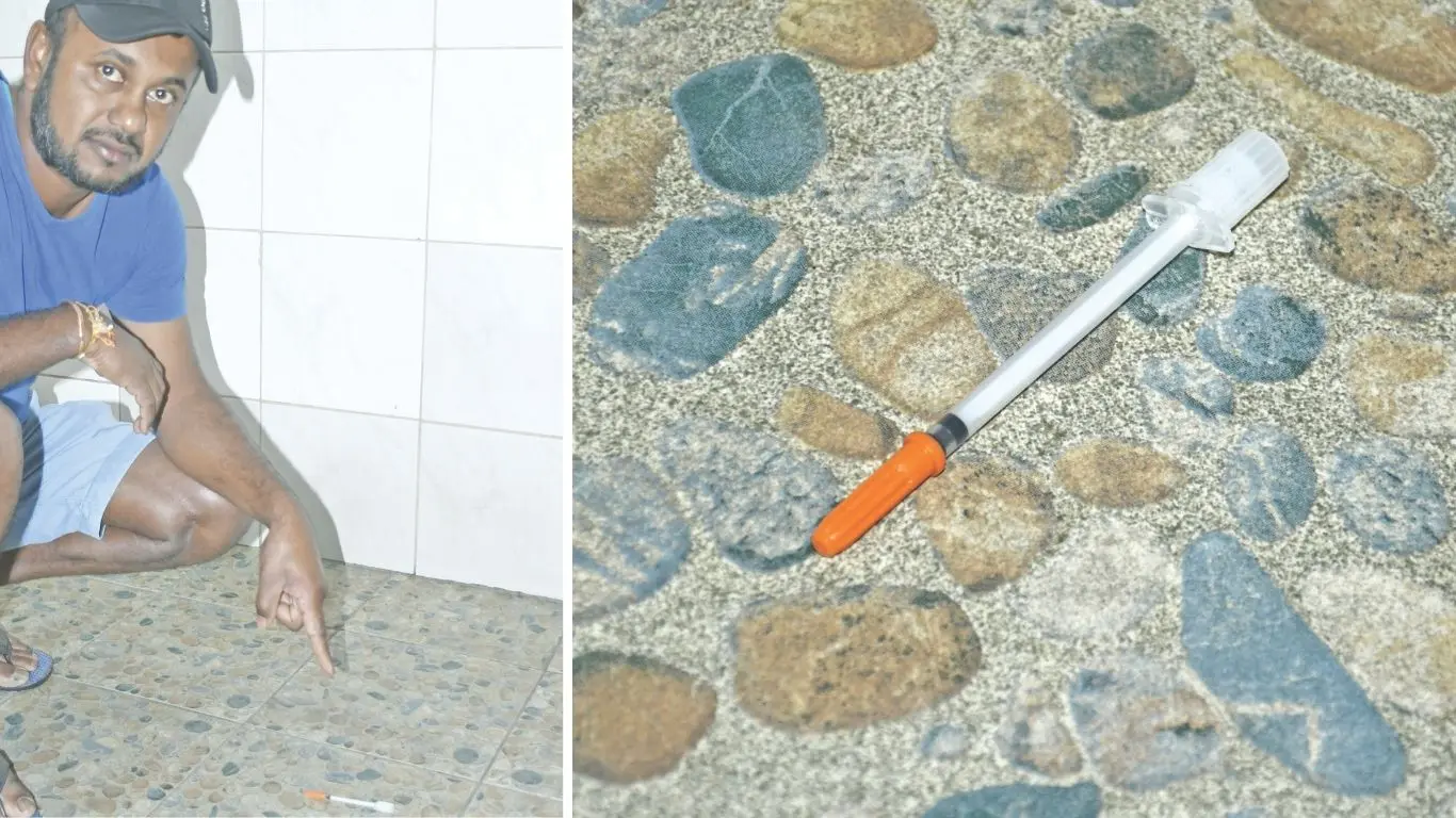 Nasole Shri Satya Prakash Mandir (Nasole Temple) president Pranil Prasad points to a syringe found at the temple following a break-in on August 24, 2026.
