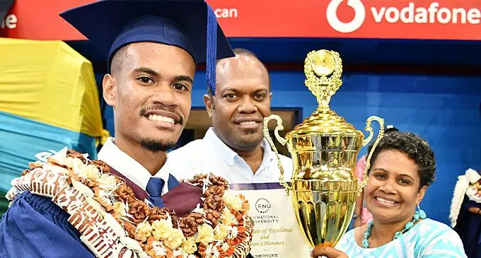 Fiji National University graduate Sakaraia Qilu with proud parents Alipate Moli and Sereima Momoelewa at the Vodafone Arena, Suva on December 11, 2024. Photo: Ronald Kumar