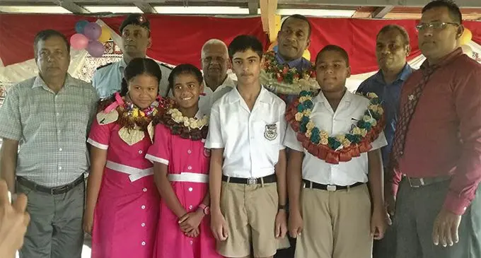 Ministry of Education principal officer Marika Baleca with Vashist Muni Primary School head prefects and school staff members.