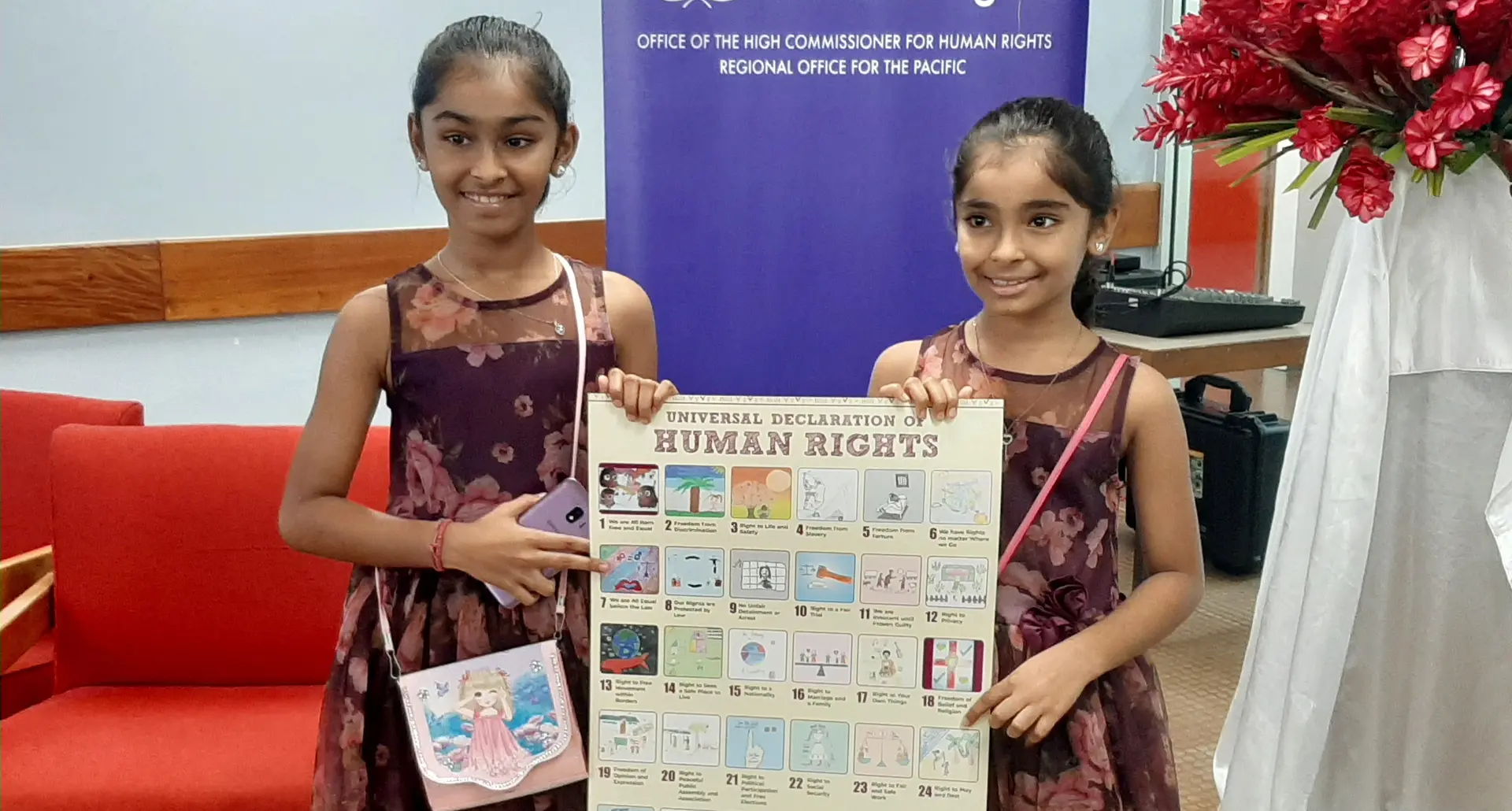 From left: Aditi Singh, who drew her art on the poster numbered three and her sister Sanaya Singh. Photo: Shreeya Verma
