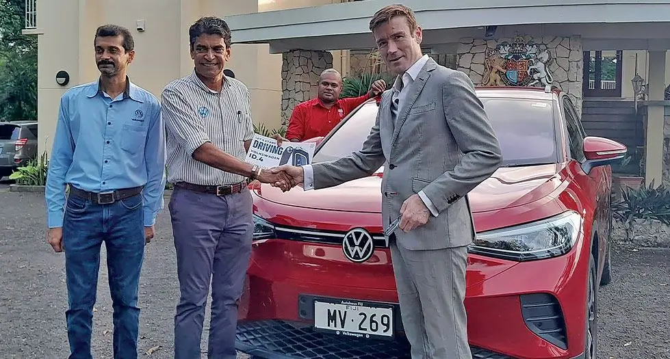 British High Commissioner Dr Brian Jones (right) during the handover of his new 2024 Volkswagen ID.4 SUV.