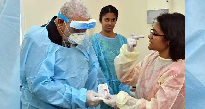 Scientific Officer Shalini Singh (right), explains a lab equipment to Prime Minister Voreqe Bainimarama as he tours the newly refurbished Molecular Lab in Tamavua, on March 11, 2020. Photo: DEPTFO News