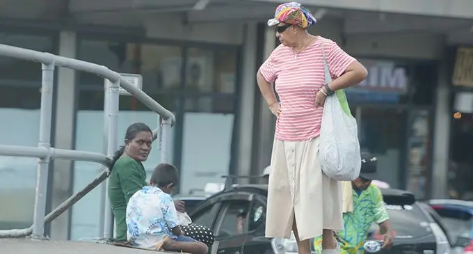 Susana Naria (right) questioned a lady using young children for begging along Thompson Street in Suva on January 31, 2023. Photo: Ronald Kumar