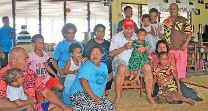 Alanieta Delai (Balck t-shirt) next to Prime Minister Voreqe Bainimarama and other evacuees at Nausori Primary School on December 29, 2019. Photo: Office of the Prime Minister