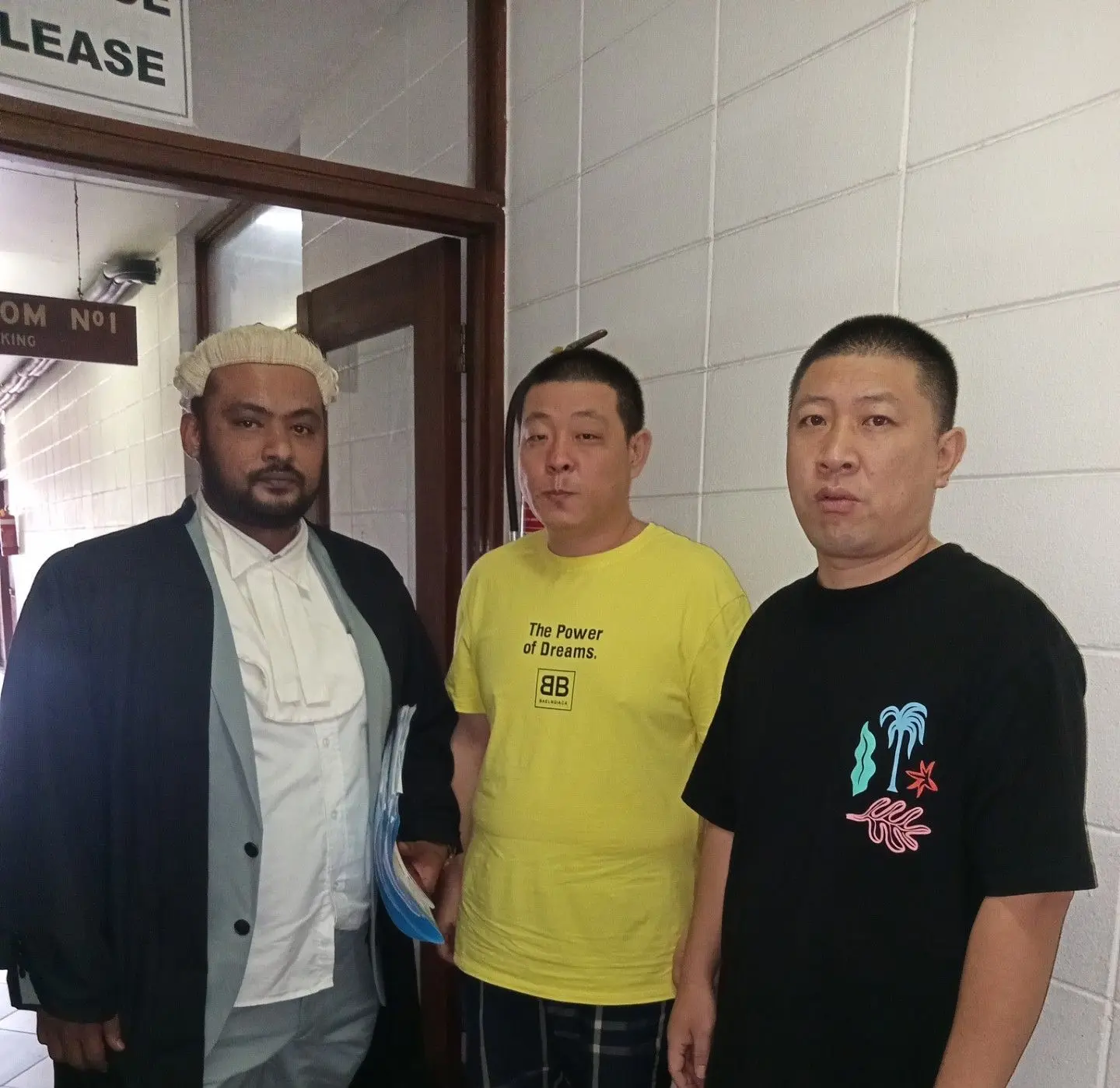 Defence lawyer Rajshneel Chand with accused Wang An and Xu Qiang at the High Court in Lautoka on December 10, 2025.