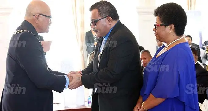 President Major-General (Ret’d) Jioji Konrote (left), with 50th Anniversary of Independence Commemorative Medal recipient Setareki Macanawai (middle) and Mr Macanawai’s wife at the medal ceremony at State House in Suva on October 5, 2020. Photo: Shalveen Chand
