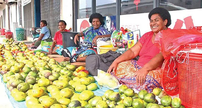 From right: Anaise Gucake, Sereima Sabeta and Laisiana Tinaitukana, 52 (far left) in front of Integrated Restaurant in Walu Bay,