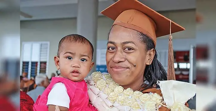 University of the South Pacific graduate Ema Tagi Druavesi with her daughter, Luisa during the USP graduation ceremony at the Vodafone Arena in Suva on August 31, 2023 . Photo: Fariya Khan