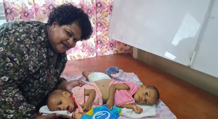 Fiji's conjoined twins begin journey to life-changing surgery in Saudi Arabia
