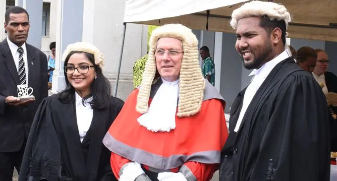 Chief Justice Anthony Gates, with new lawyers Namrata Singh (left) and John Prasad after their admission to the bar.  Photo: Ronald Kumar
