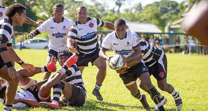 Nadroga full-back Lilo Veiseivalu (with ball) tackled against Rewa on April 9, 2022. Photo: Leon Lord