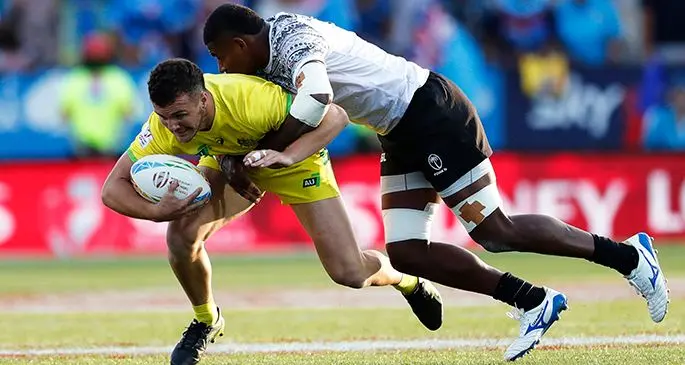 The Fiji Airways Fijian 7s forward Apenisa Cakaubalavu tries to tackle Australian 7s winger Trae Williams during the LA 7 Photo: World Sevens Rugby