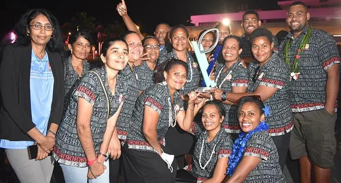 Rooster Chicken staff members with the Super W title at Nadi International Airport on May 8, 2022.It’s the first time for the Super W title to travel out of Australia. Photo: Mereleki Nai