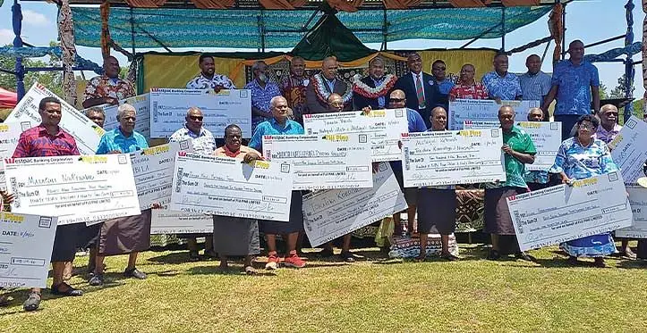 Pine landowners with their lease security bonus payments handed out by the Acting Minister for Fisheries and Forests Jese Saukuru. Photo: Charles Chambers