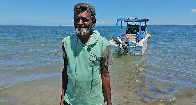 Mohammed Fareed with his fishing boat at Wailoaloa Beach. Photo: Mereleki Nai 