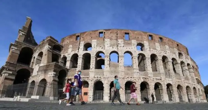 People are seen at the Colosseum in Rome, Italy, on May 8, 2020. (Photo by Alberto Lingria/Xinhua)