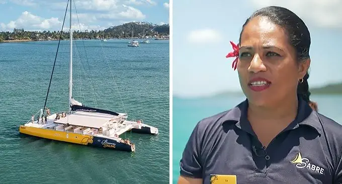 The SABRE in the the beautiful Mamanuca waters and Cruise Director for SABRE, Elizabeth Antonio.