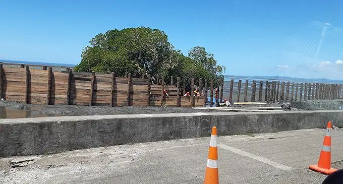 Workers constructing a wall parallel to the seawall along the Queen Elizabeth Drive and close to the Nasese Bridge in Suva. Photo: Shalveen Chand