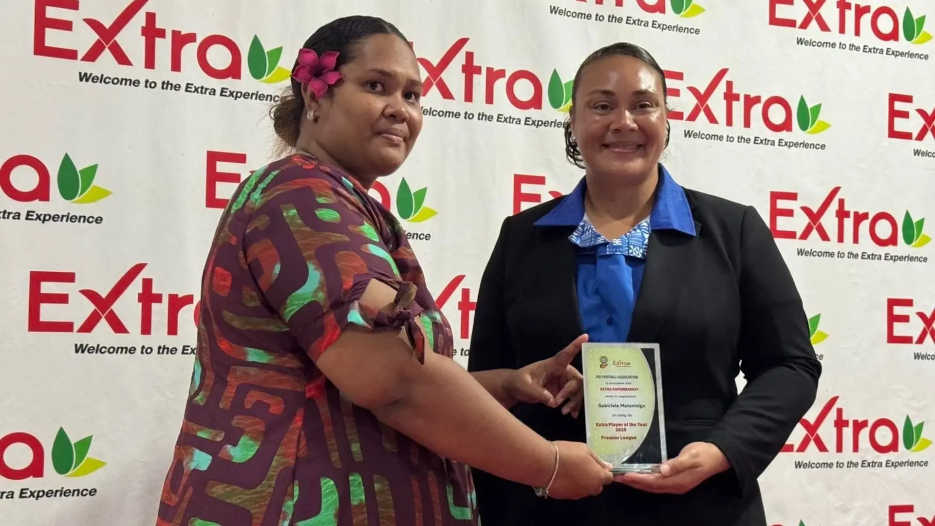 Elvera Norma receives the award on behalf of her husband, Gabiriele Matanisiga.