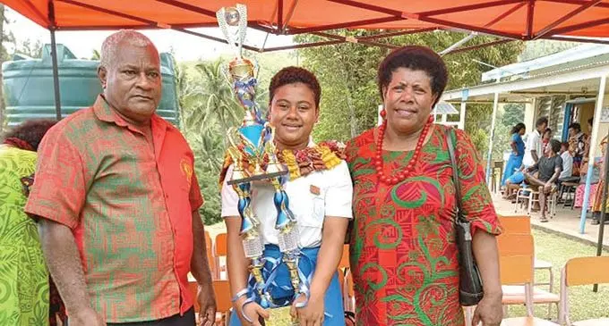From left: Sulio Bulinadi (uncle), Maria Rosalia Ratusuli and Sereima Dinuku (aunt) after the prizegiving ceremony at Immaculate Conception College in Solevu, Bua on December 3, 2020.