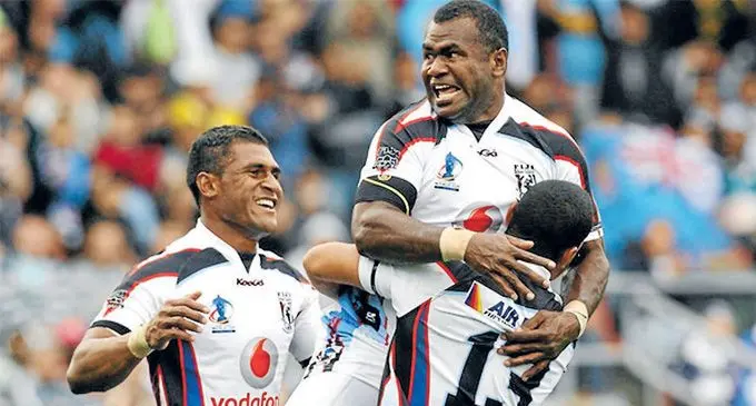 Local -based Fijian Bati players Alipate Noilea and Ioane Divavesi celebrate the win over France at the 2008 Rugby League World Cup in Sydney, Austr