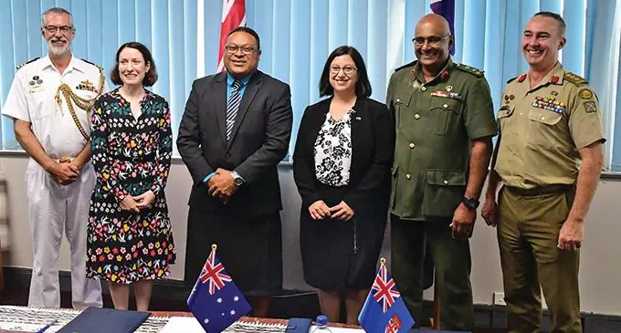 Permanent Secretary for the Ministry of Defence and National Security Manasa Lesuma (third from left), the Assistant Secretary Indo-Pacific Enhanced Engagement Branch, International Policy Division, Australian Department of Defence, Sue Bodell (fourth from left), Republic of Fiji Military Forces (RFMF) Deputy Commander Brigadier-General Mohammed Aziz (fifth from left) with Australian Defence Force personnel after the signing on April 16, 2019. Photo: DEPTFO News