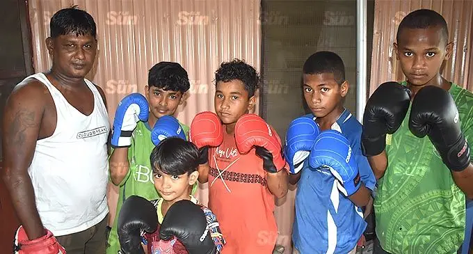 Faiyaz Ali (first from left) with aspiring boxers at their clubhouse in Nawaka, Nadi. Photo: Waisea Nasokia