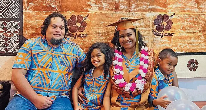 Sera Tikotikovatu-Sefeti (third from left), with her family after she graduated from the University of the South Pacific last week. 