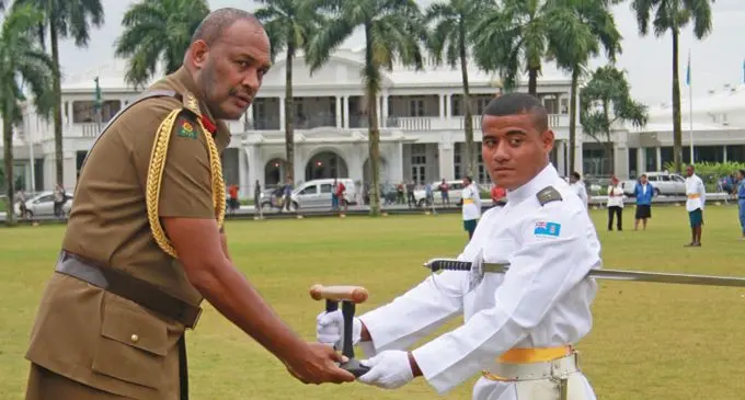 Taka Vulaono reveiving the Baton of Honor Award from the RFMF Land Force Commander Colonel Manoa Gadai at Albert Park in Suva on September 04, 2019. Photo: Kelera Sovanisiga.