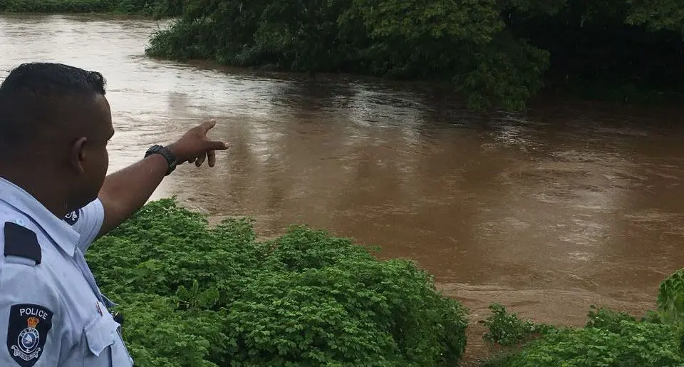 An officer from Namaka points to the spot where they had to stop children from swimming