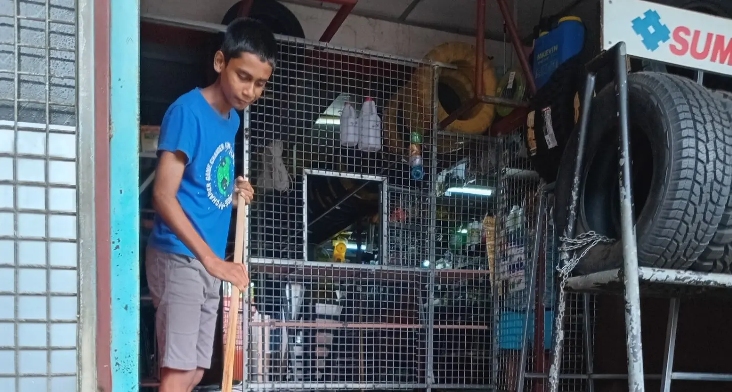 Aiyan Kumar cleans their shop. 