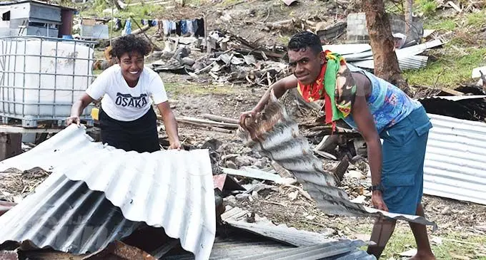 Yaro villagers Ece Takaiwai (left) and Apisai Naisarani, on Kia Island on December 29, 2020, have started to rebuild their homes from the wreckage after Cyclone Yasa mada landfall on December 14, 2020. The island was one of the hardest hit by the category 5 storm. Photo: Laisa Lu