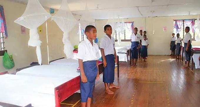 Assistant Minister for iTaukei Affairs Selai Adimaitoga hands over mattresses and beds to management and teachers of Kubulau District School in Bua on March 4, 2022.  Photo: DEPTFO News