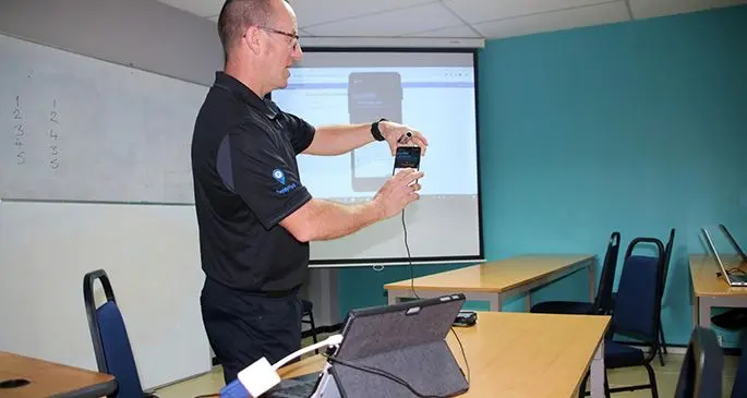 ADR Sales and Development Manager, Peter MacKenzie demonstrates the functions of the new hand-held meter reading devices at the WAF Training Room, National Office in Nasinu. Source: WAF