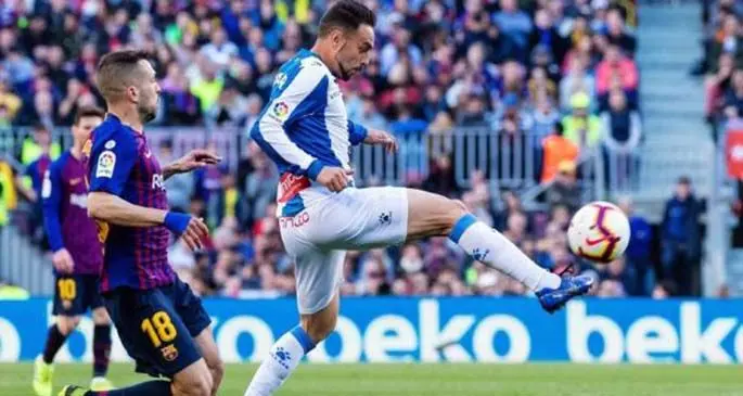 FC Barcelona's Jordi Alba (L) competes with Espanyol's Sergio Garcia during a Spanish league match between the two clubs in Barcelona, Spain, on March 30, 2019. FC Barcelona won 2-0. (Xinhua/Joan Gosa)