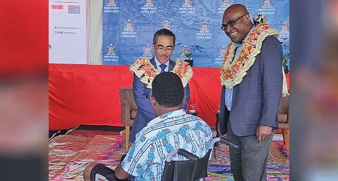 Indonesian Ambassador to Fiji, Dupito Simamora presenting the equipment to Health Minister Dr. Atonio Lalabalavu.