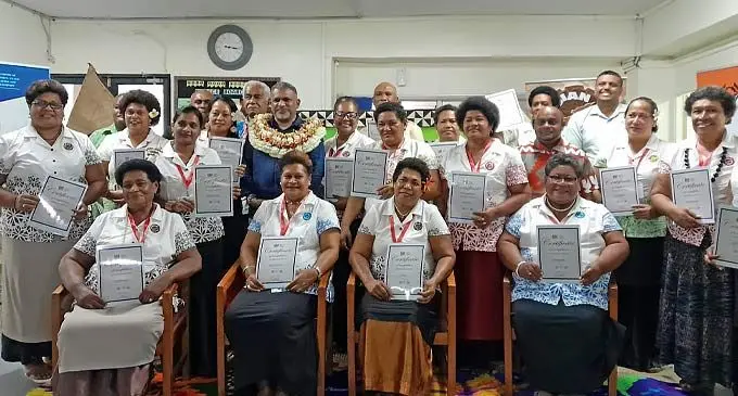 Minister for Commerce, Trade , Tourism and Transport. Faiyaz Koya (standing with garland )with Fiji business training recipients at the Fiji arts council head office on November 23 2022 Photo: Sosiveta Korobiau