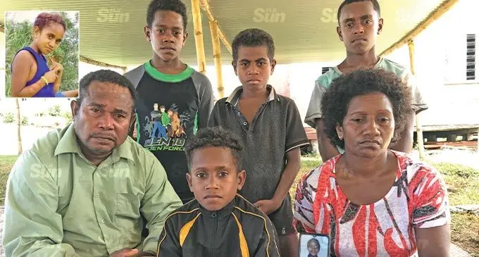 Family of the late Temalesi Votea. Sitting: Kalaveti Rokosui, Sakiusa Josua, Kirisitiana Buasega with a picture of Tema from a phone. Back: Manoa Ratunaisiwa, Sakiusa Sakaru(first life saver), Joeli Fotowaika. Inset-right: Temalesi Votea.  Photo: Laisa Lui