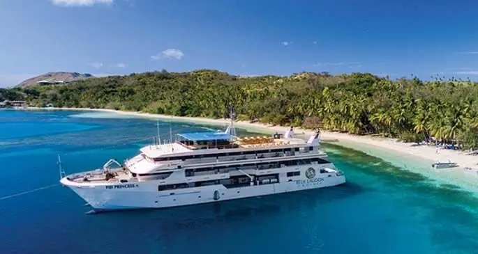 A Blue Lagoon Cruises vessel anchored off an island in the Yasawa Group.