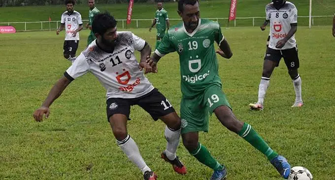Suva midfielder Ravinesh Karan Singh (left) challenges Christopher Kumar of Nadi during their Digicel Premier League clash at Prince Charles Park, Nadi, on April 3, 2022. Photo: WAISEA NASOKIA 