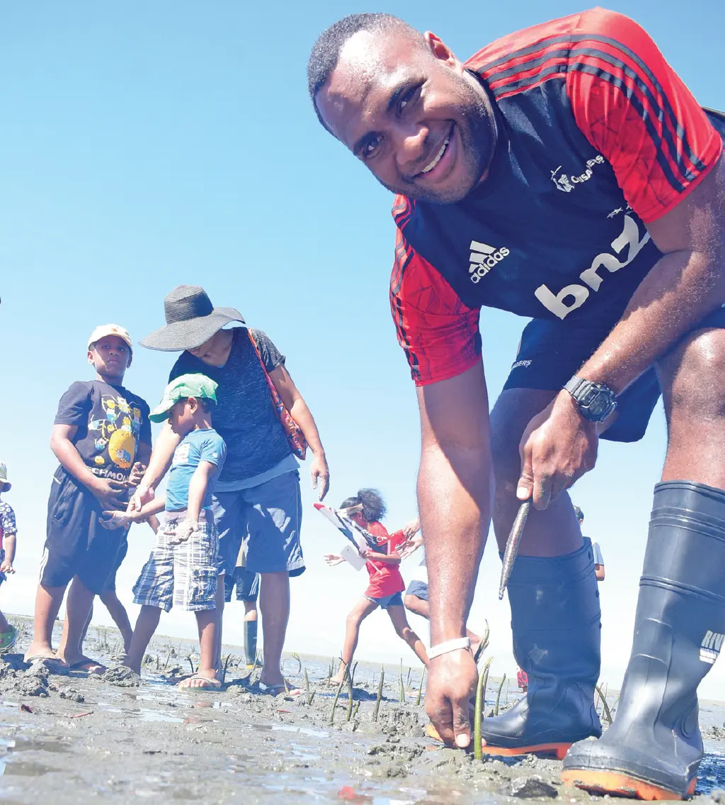 Fijian-born Crusaders player Manasa Mataele planting mangrove seedlings with Fiji Airways and Ministry of Forestry staff along the Suva foreshore on June 1, 2019. Photo: Ronald Kumar.