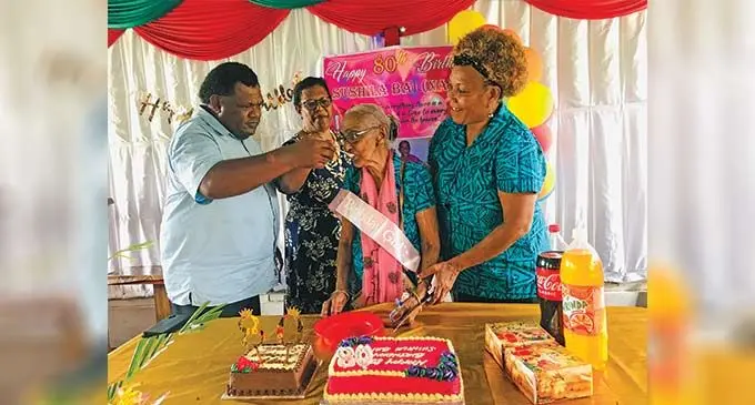 Waidamudamu Gospel Brethren church members celebrate Sushila Bai’s 80th birthday after their Christmas Service. Photo: Laisa Lui