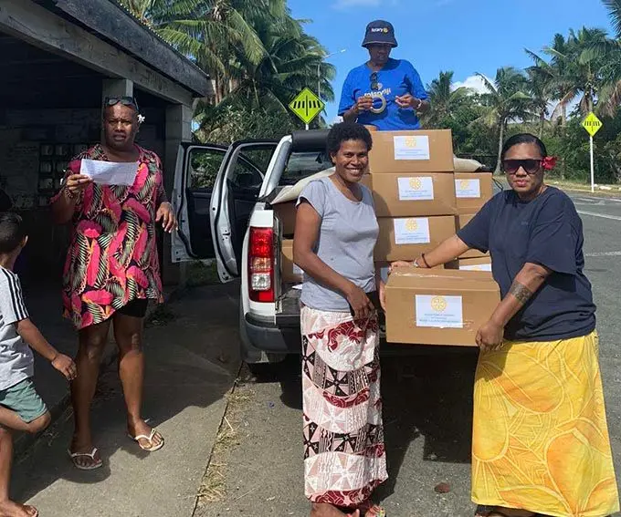 The Rotary Club of Lautoka (District 9920) Youth Ambassador and Projects, Melissa Natawake (right) with  members of the club during their distribution to the Korotogo families at Malevu  and KorotogaoVillage in Sigatoka.  